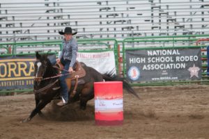 Maddie Hale rounds the final barrel. She was the fastest Wyoming rider with a time of 18.674 seconds.