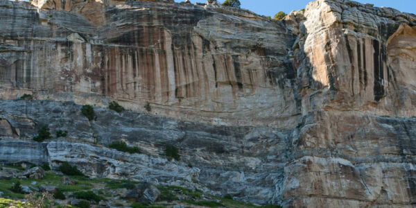 A large canyon in Sinks Canyon State Park near Lander, Wyoming, has lush vegetation and intricate rocky details.