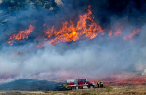 Crews battle fast-growing wildfire in windy Southern California that's forced some to evacuate