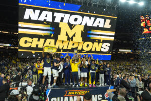 Michigan muscles its way to program's 2nd national title, beating stubborn UConn 69-63