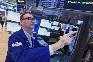 Wall Street flirts with records after oil prices give back some of Monday's spurt