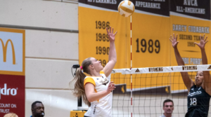 Cowgirls Close Orange & Black Classic with Four-Set Win